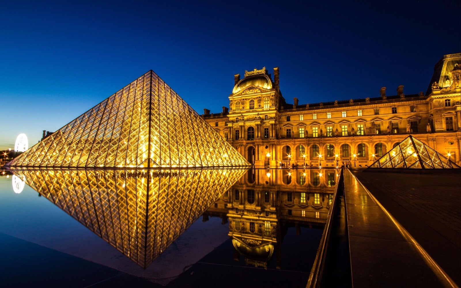 Louvre Museum glass pyramid at night